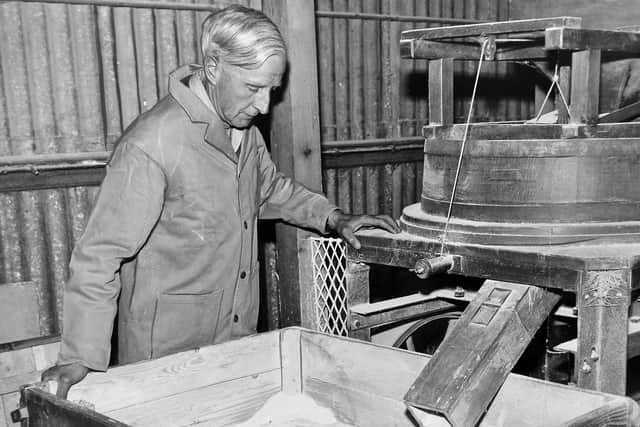 A 1960 photo of Sam Mayall in the mill where the wheat was ground.