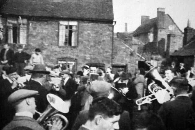 This Victory in Europe celebration street party was being held at Lloyds Head, Jackfield, at 4pm. Ron Miles, who helped set up the tables, was celebrating his 16th birthday.