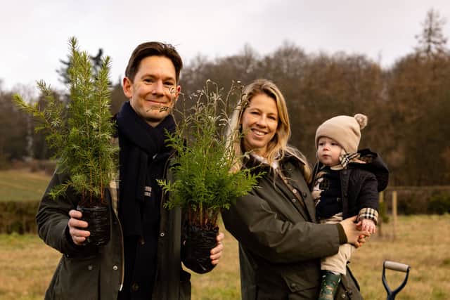 Alexander and Eliza Newport with son Archie, join the woodland walk planting.