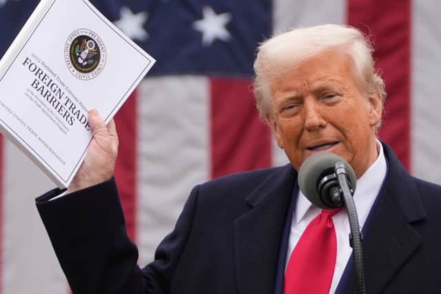 President Donald Trump announces new tariffs in the Rose Garden at the White House (Mark Schiefelbein/AP)