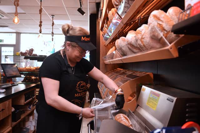 Agnieszka Porebna slices bread at Masovia Bakery, New Street, Wellington, Telford on Thursday, March 27, 2025