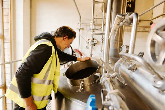 Steve Wood keeps an eye on the brewing process