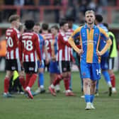 Taylor Perry of Shrewsbury Town looks frustrated after his side fall to another defeat (AMA)