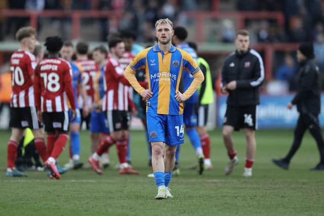Taylor Perry of Shrewsbury Town looks frustrated after his side fall to another defeat (AMA)