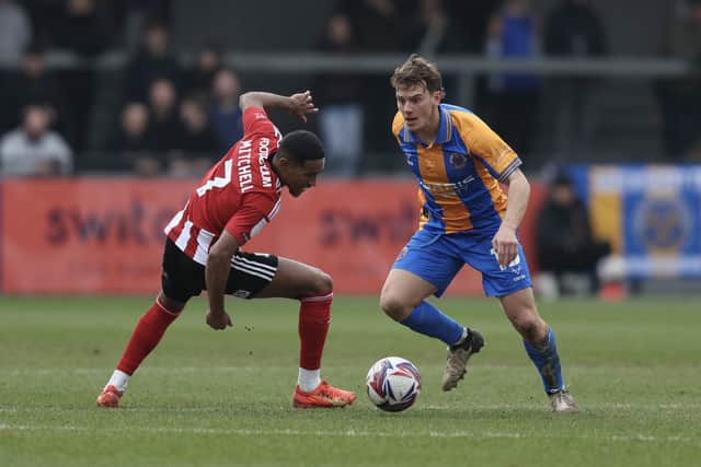 Dom Gape of Shrewsbury Town and Demetri Mitchell of Exeter City