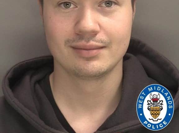 Alexander Westwood smirks in his mugshot