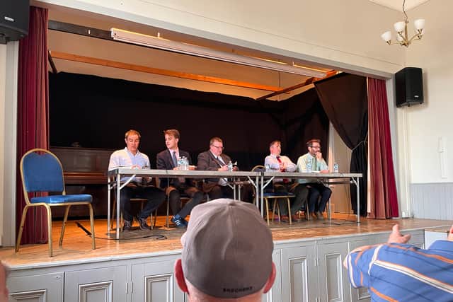 Mr Lewis - far left - at a pre-election hustings in Montgomery Town Hall last year