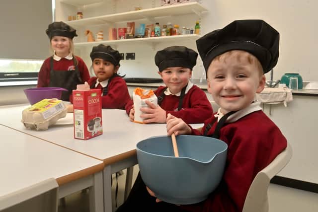 Bowbrook Primary School in Shrewsbury. Alma, Madhavi, Reuben and Parker, all aged five, in the cooking room.