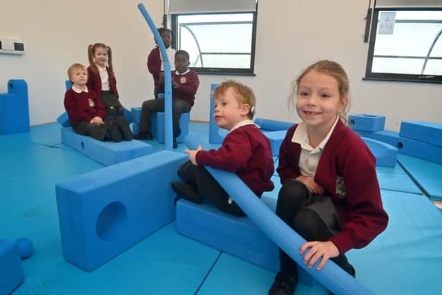In the dance studio with the 'Imagination Playground'. Front is: George and Georgia, both five. Back: Henry, five, Elsie-Jane, five, Zahra, six, and Nathan, five