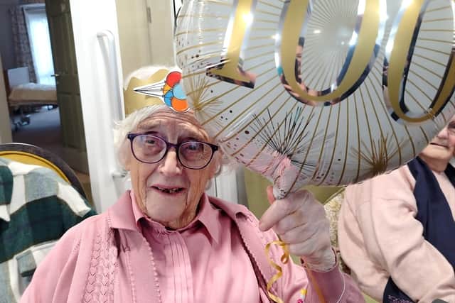 100 years young - Iris with her birthday balloons
