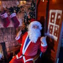 Santa in his grotto in Builth Wells previously, greeting youngsters and giving them a gift