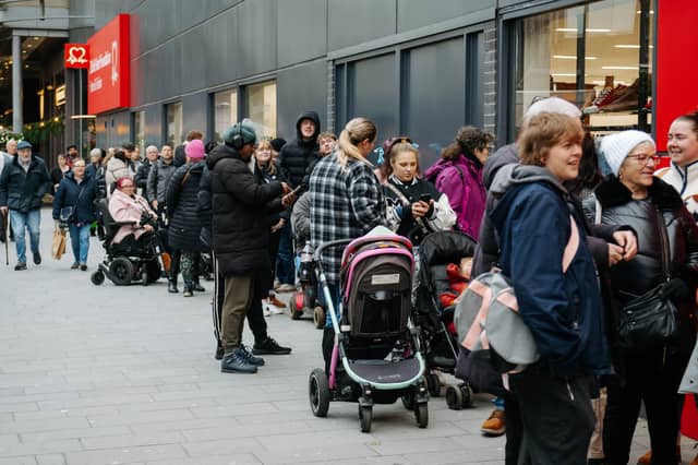 Shoppers queued waiting for the brand New British Heart Foundation Megastore to open.