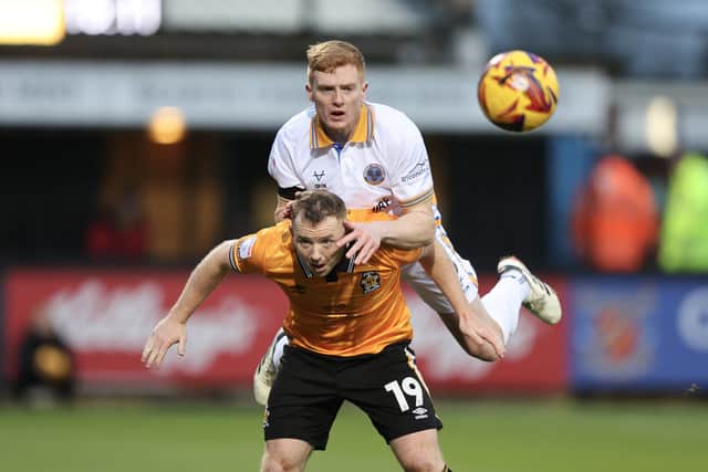 Morgan Feeney of Shrewsbury Town and Shayne Lavery of Cambridge United (AMA)