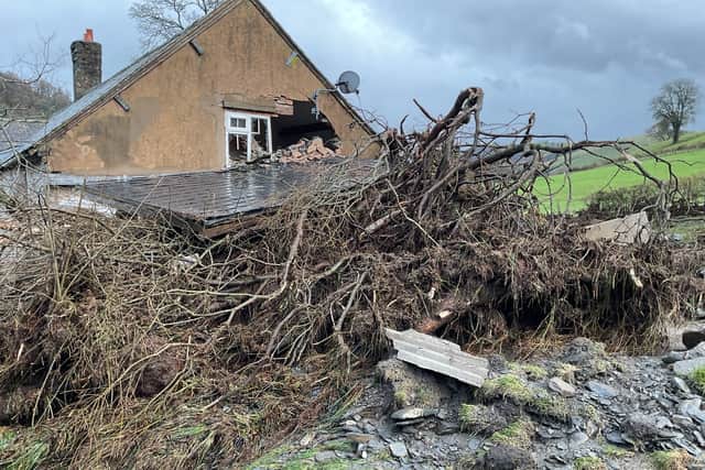 A landslide caused trees to damage the farmhouse. Picture: Trevor Bates