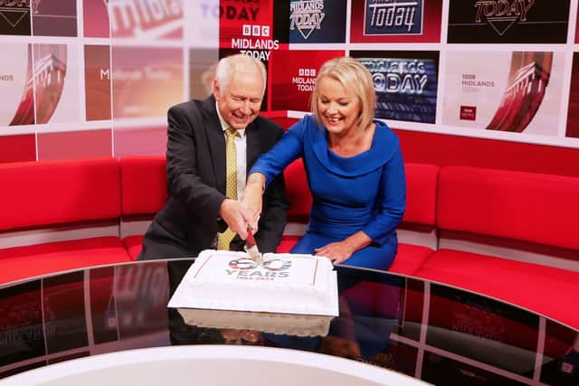 Nick Owen and Mary Rhodes mark an anniversary by cutting a special cake