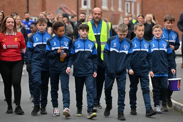 Young footballers take to streets to raise money in memory of 'selfless ...