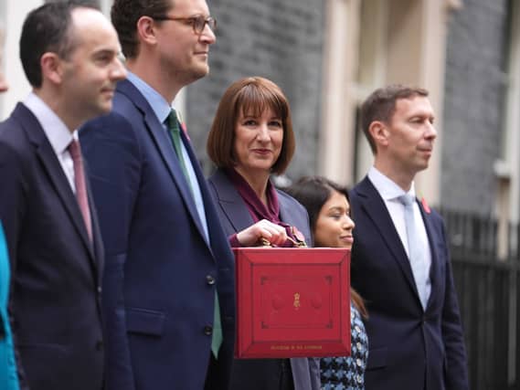 Chancellor of the Exchequer Rachel Reeves poses outside 11 Downing Street with her team ahead of delivering her first Budget