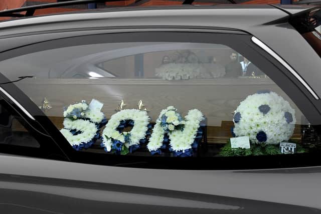Two floral tributes to Albion fan Mark Townsend whose funeral took place on Friday