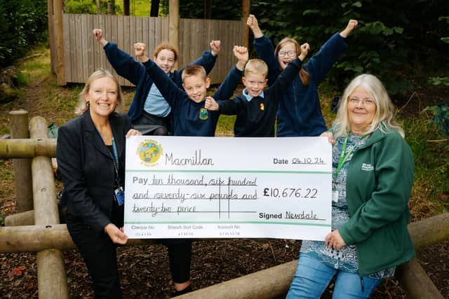Head Teacher Rachel Cook, Gracie-Mae Thompson 10, Theo Hawley 8, Harry Attwood 7, Eva Baker 9 and Carole Green from Macmillan..