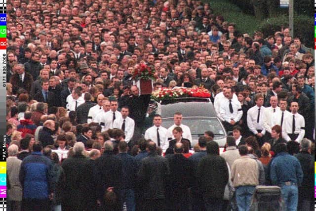 Thousands of mourners attend the funeral of murdered Loyalist Volunteer Force leader Billy Wright, in Portadown