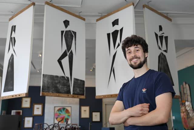 Jacob Chandler with his artwork which features in the exhibition.