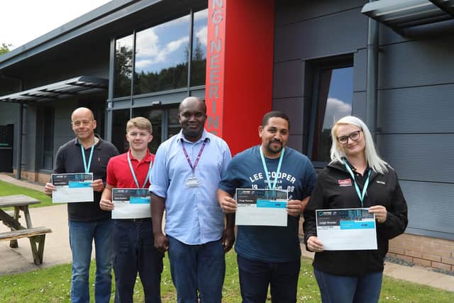 Engineering lecturer Richard Molli-Boulock, centre with the maintenanceengineers, from left, Mark Griffin, Ryan Hawkins, Craig Thomas, and Leigh Brooks