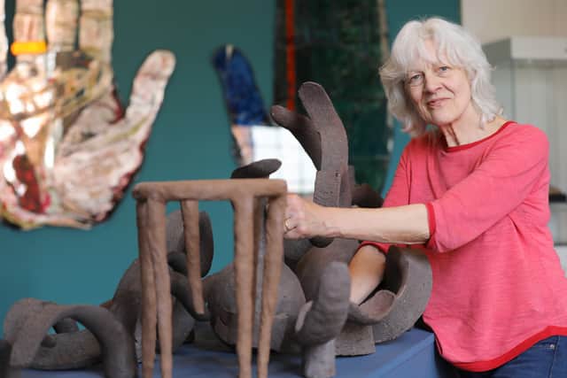 Almuth Tebbenhoff with her artwork featuring in the exhibition.