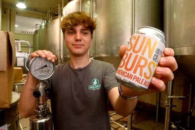 George Holden, 19, is pictured with his new creation – a craft beer called Sun Burst