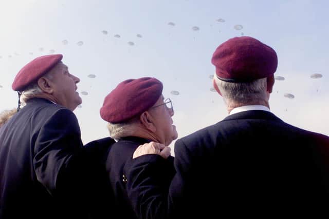 Veterens watch as over 200 Paratroopers from the 4th Battalion Parachute Regiment complete a jump near Arnhem in Holland in 1999