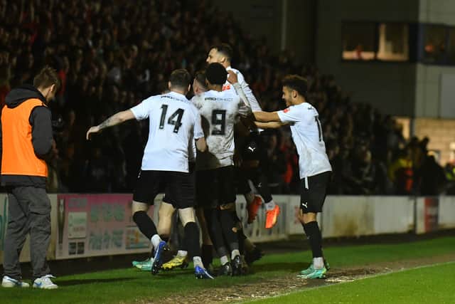 AFC Telford players celebrate with Remi Walker after he makes it 2-0 (pic Kieren Griffin)