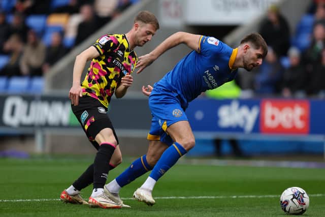Tom Bloxham of Shrewsbury Town and Jack Armer of Carlisle United (AMA)