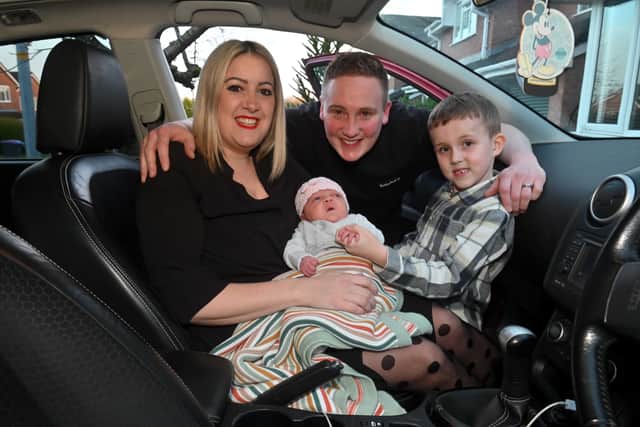 Parents Karla-Anne and Edd with Finley and and Darcy-Anne, who was born in their family Nissan