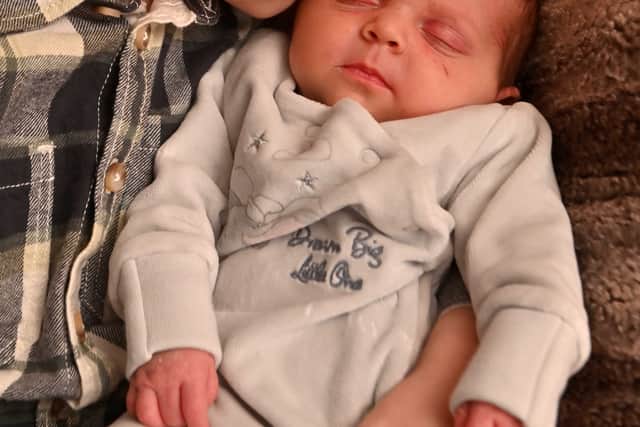 Finley with his new baby sister