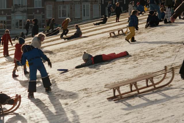 Occupied City: Children on snow-laden slopes in Amsterdam