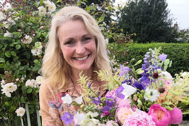 Amanda with one of her colourful, scented bouquets