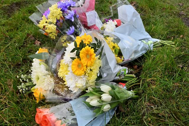 Flowers left at the scene of Tuesday's crash