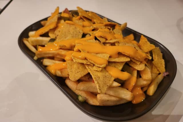 A plate of cheesy chips
