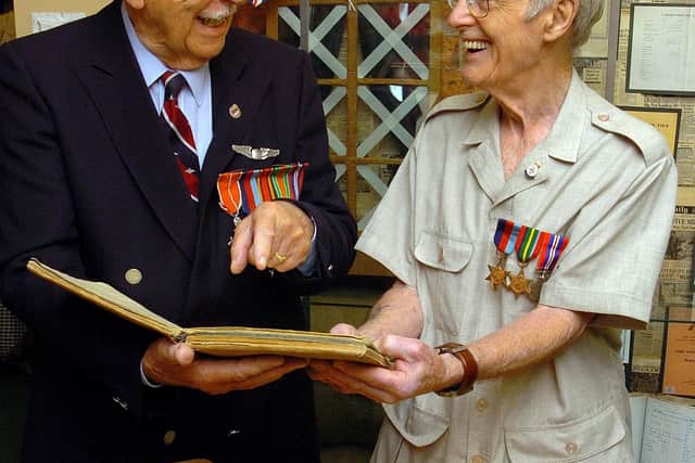 Jack Jennings, right, with Jim Cutler, who was a former pilot, recalling old memories during their visit to Stourbridge library, which featured an exhibition of various items relating to both men in 2005