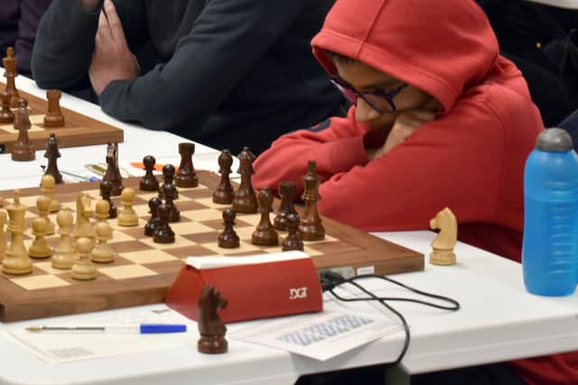 Eleven-year-old Adithya Vaidyanathan – who won the top Open section – ponders his move in the final round.