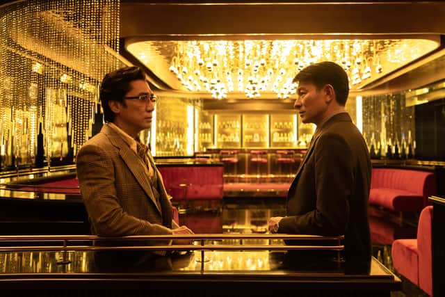 The Goldfinger: Tony Leung as Ching Yat-yin and Andy Lau as Lau Kai-yuen