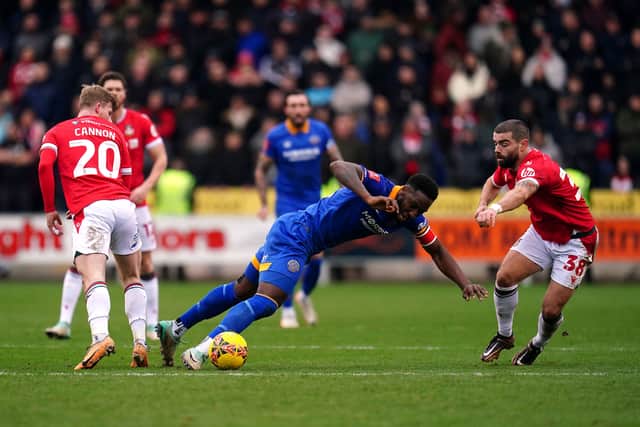 Shrewsbury Town's Chey Dunkley and Wrexham's Elliot Lee