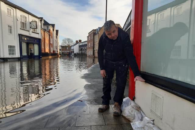 Lee McGowan shows where the floods of 2000 reached in comparison to Thursday's peak in Longden Coleham