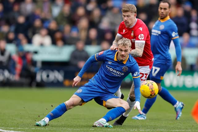 Taylor Perry battles with Wrexham's James McClean (AMA)