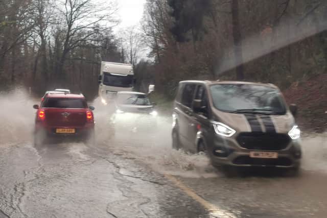 Traffic pushing through standing water on the Welshpool-Shrewsbury road on Tuesday afternoon. Photo: Barry Evans