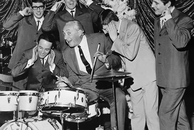 Hughie Green at the Granada theatre in Shrewsbury in January, 1969, when he was presenting his Christmas show. He is pictured with Shropshire vocal harmony group The Dee Jays, who were soon to appear on Opportunity Knocks.