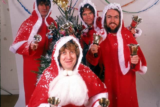 Slade dressed as father Christmas's for their Christmas Number one single Merry Christmas Everybody in 1973