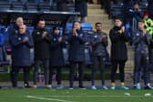 Matt Taylor the head coach of Shrewsbury Town observes a minute of applause. Credit: AMA