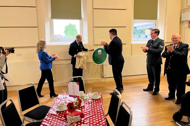 The Duke unveils a plaque marking 150 years of Dawley Town Hall.