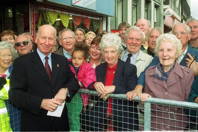 Sir Bobby Charlton chats to the crowds after unveiling the Duncan Edwards statue in 1999