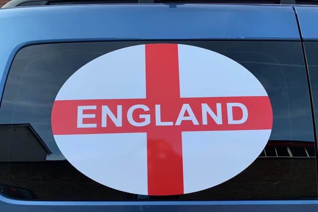 John Brockhurst has been asked to remove the cross of St George from his hackney carriage